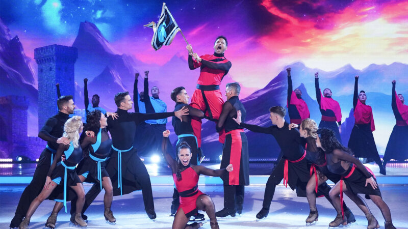 Ryan Thomas performing his final skate for Dancing On Ice, being raised aloft and waving a flag